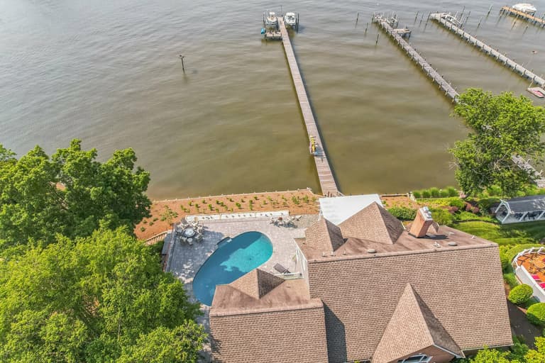 Aerial view of the property's shoreline and private dock
