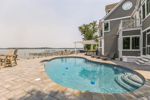 The pool deck looking toward the private dock and the marina beyond