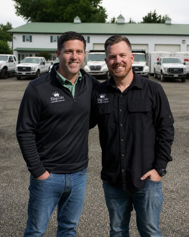 King Cuts founders and brothers Bret and Keith Whetzel in front of the truck fleet at the shop