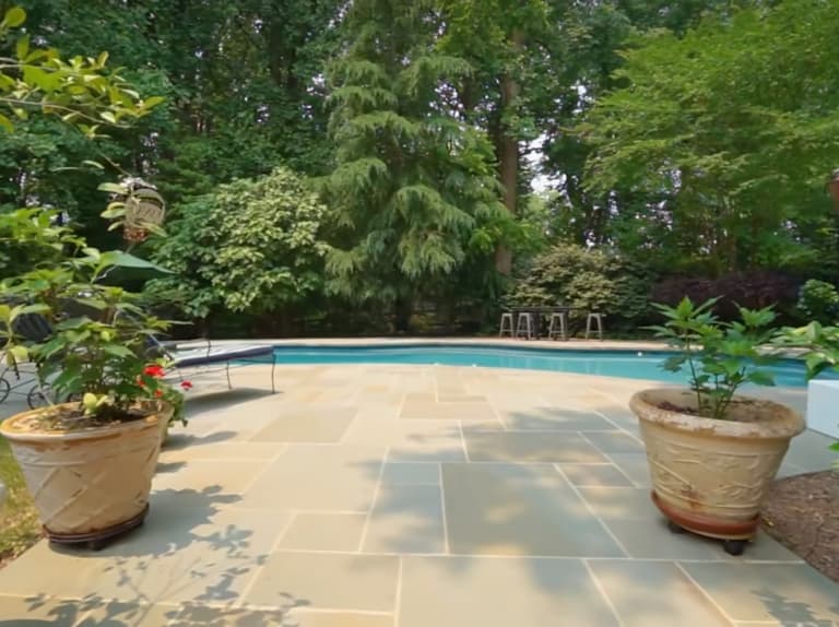 Flagstone patio and pool deck with stone planters