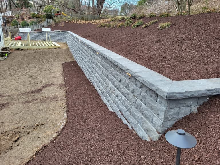Tiered segmental retaining wall below a mulched planting bed