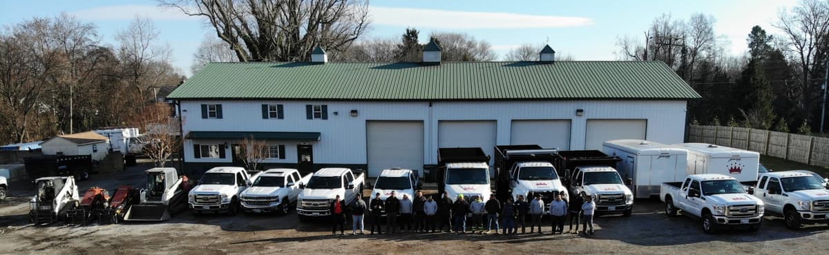 Aerial view of the full King Cuts crew and truck fleet at the shop